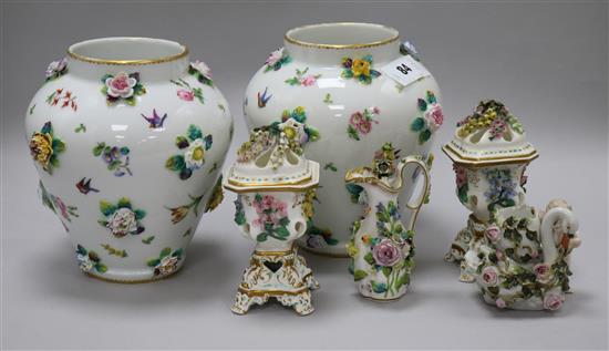 A pair of continental porcelain floral encrusted vases, 18cm, a pair of pot pourri vases, a jug and a swan vase